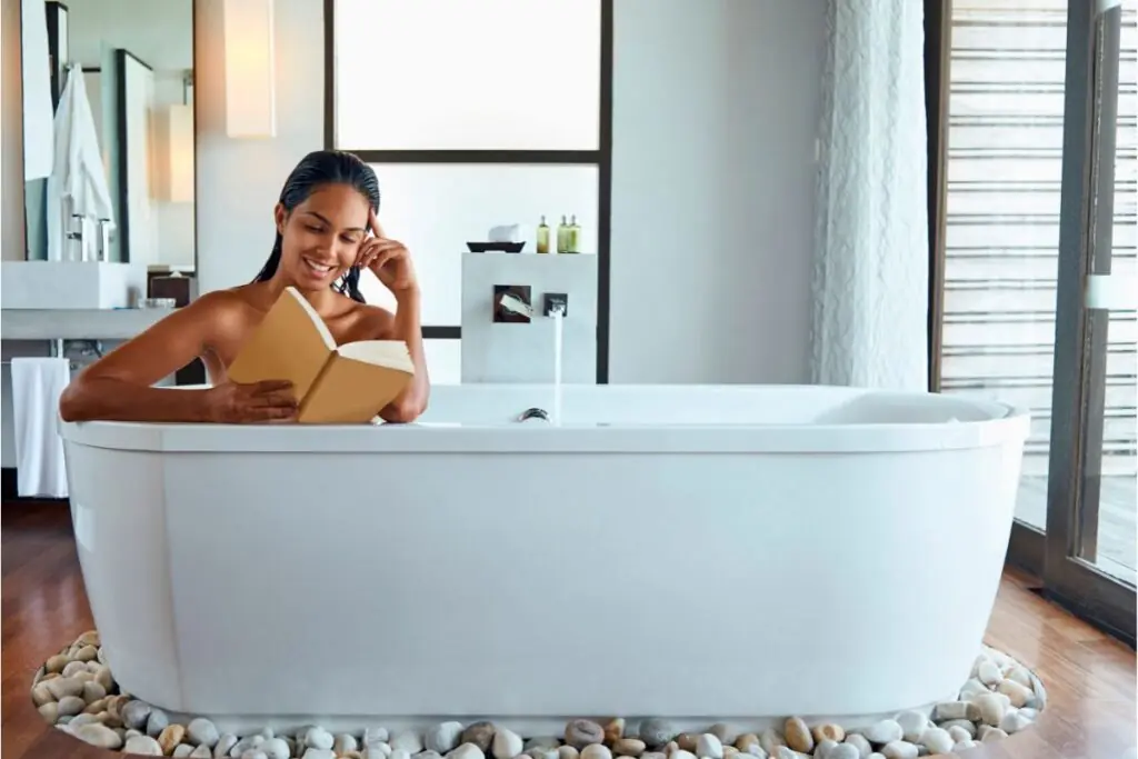 woman reading a book and enjoying extra bathroom