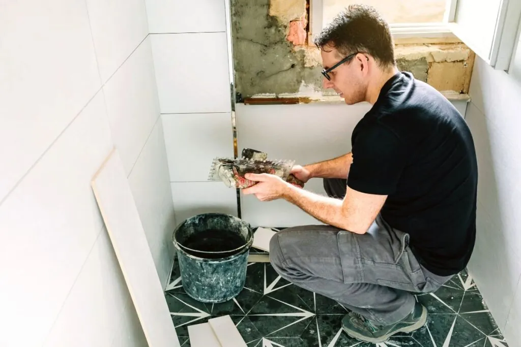 mason working on a bathroom renovation