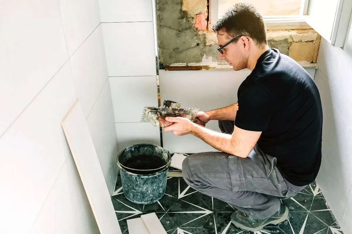 mason working on a bathroom renovation