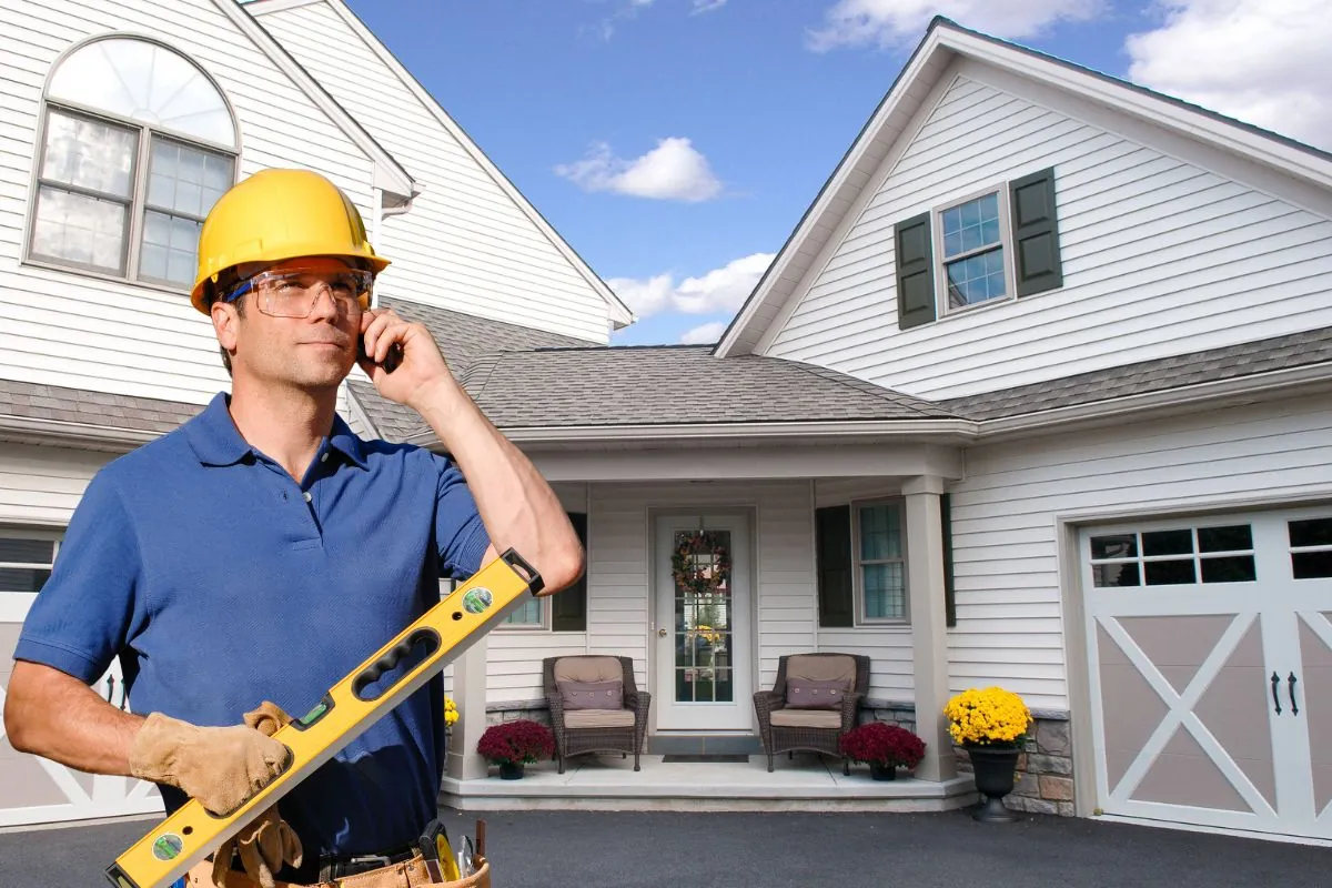 a professional contractor near in-law suite holding cellphone